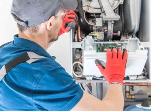 Gas Safe engineer repairing a boiler in Luton